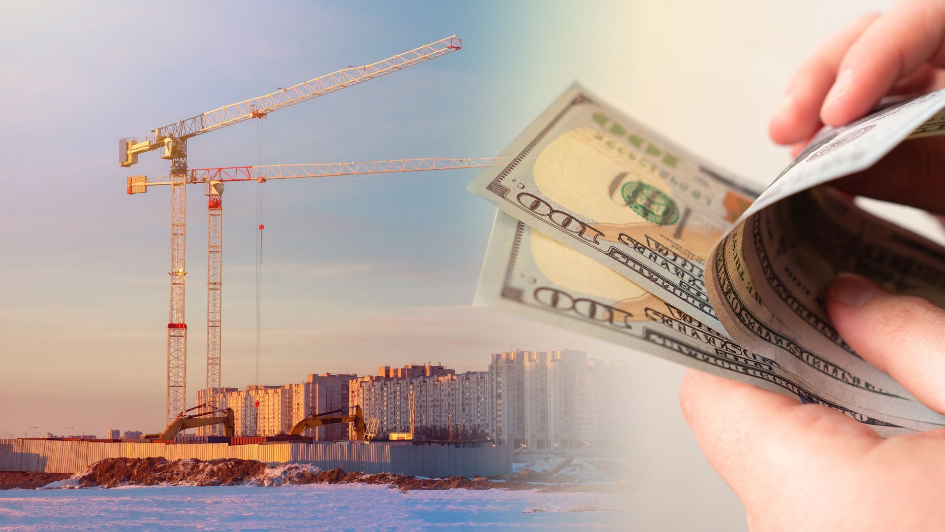 A person is holding a stack of money in front of a construction site.