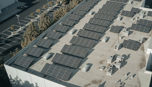 solar panels on the roof of a building .