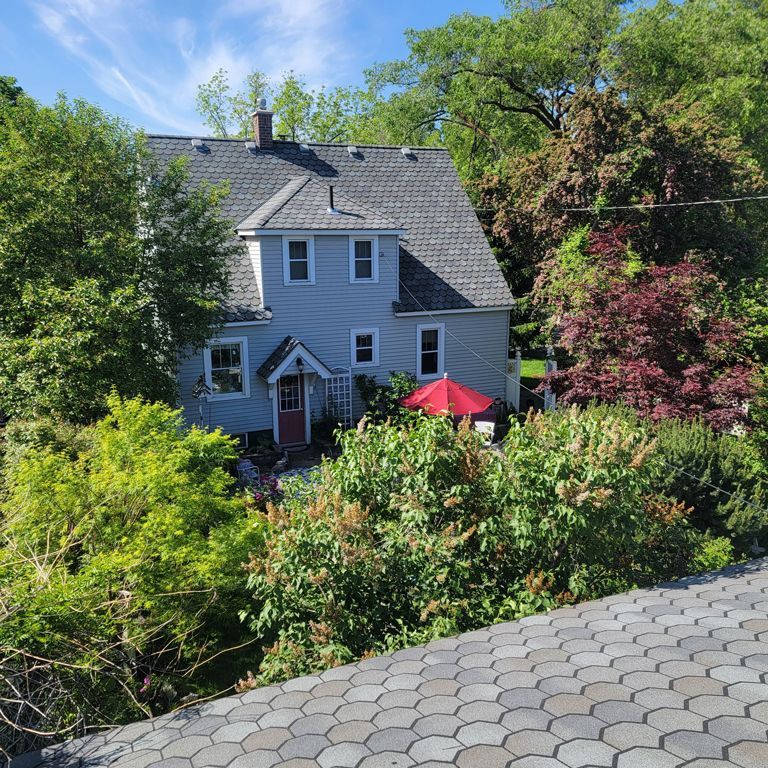 A house with a red umbrella in front of it - Spokane Valley, WA