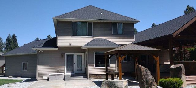 A large house with a gazebo in front of it in Spokane WA.
