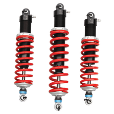 Three red and black motorcycle shock absorbers. | Importsports