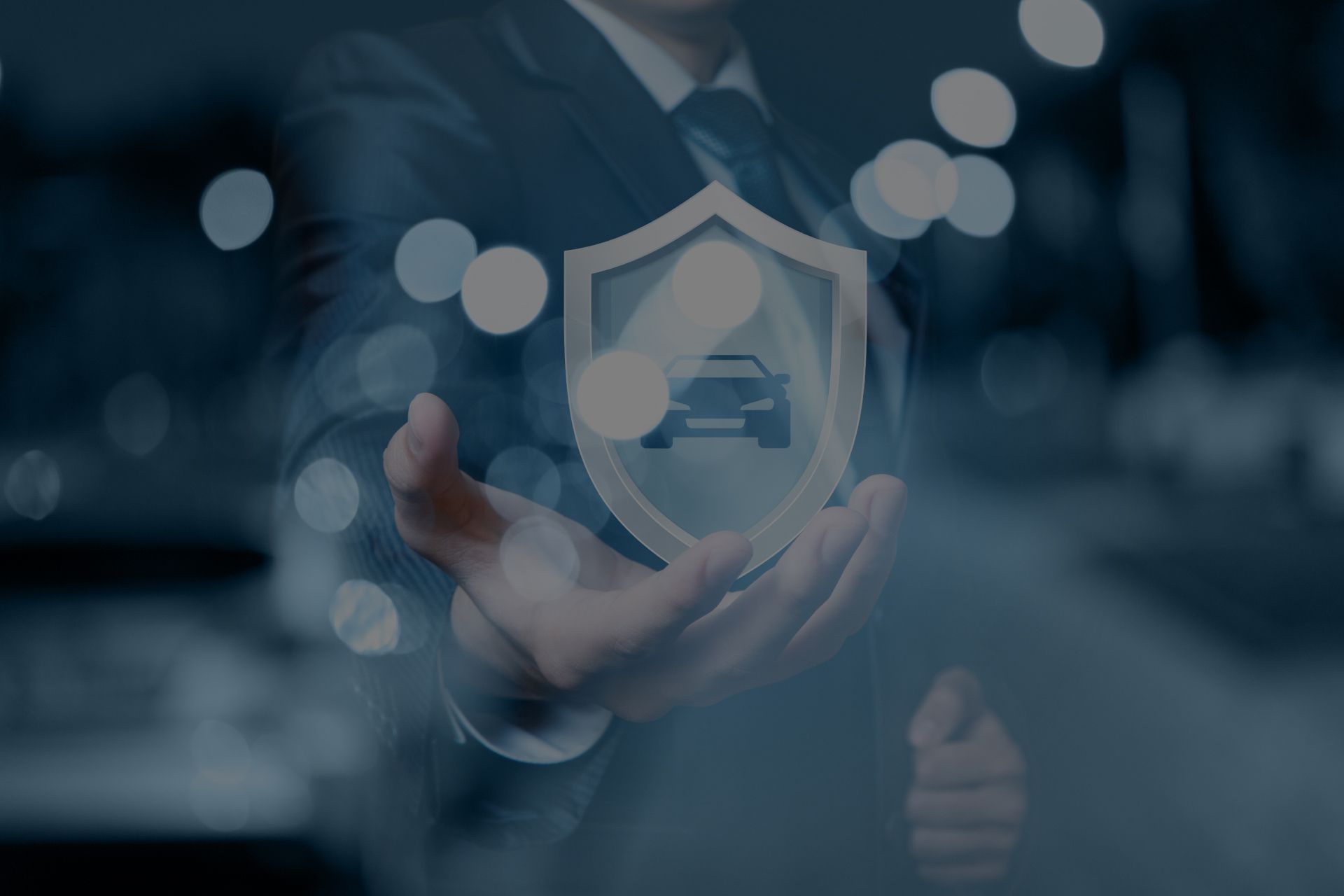 Person holding a shield with a car icon, symbolizing car insurance. | Importspor