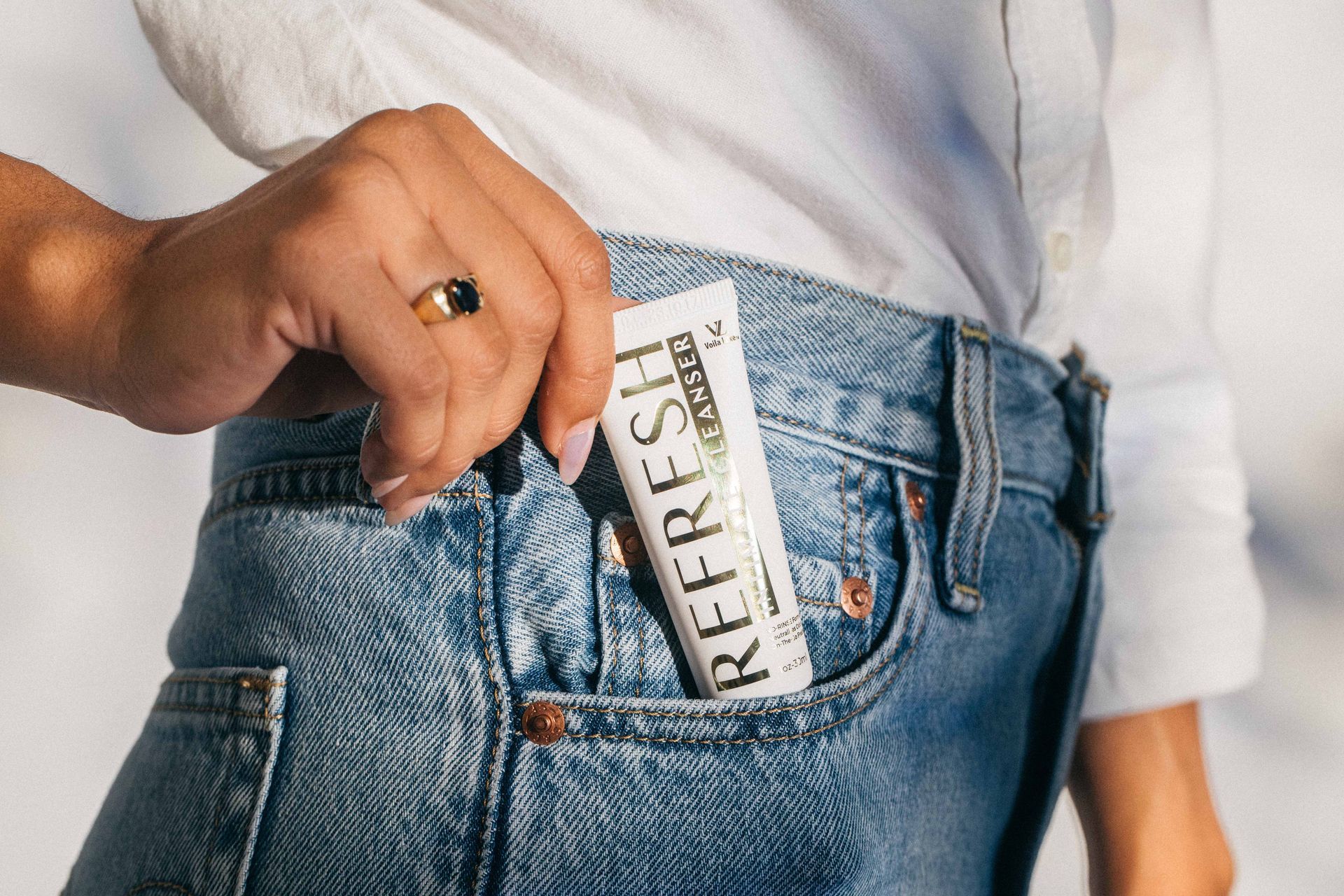 A group of women are lifting dumbbells in a gym.