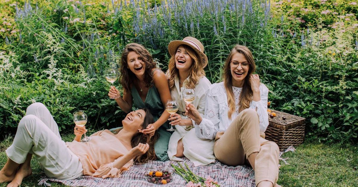 A group of women are having a picnic in the park.