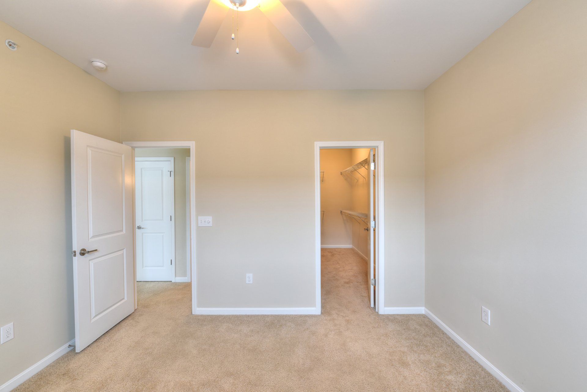 Grandview Village Bedroom Photo With Walk-In Closet