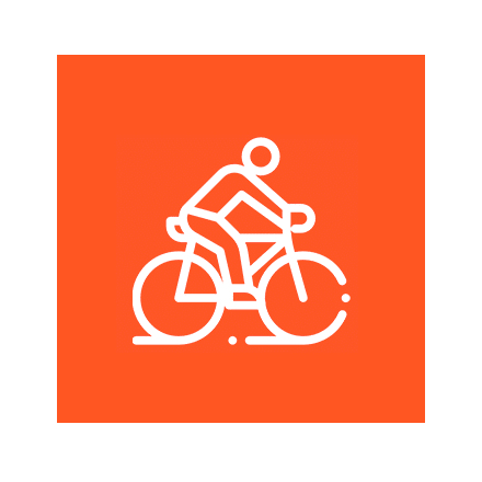 A person is riding a bicycle on an orange background.