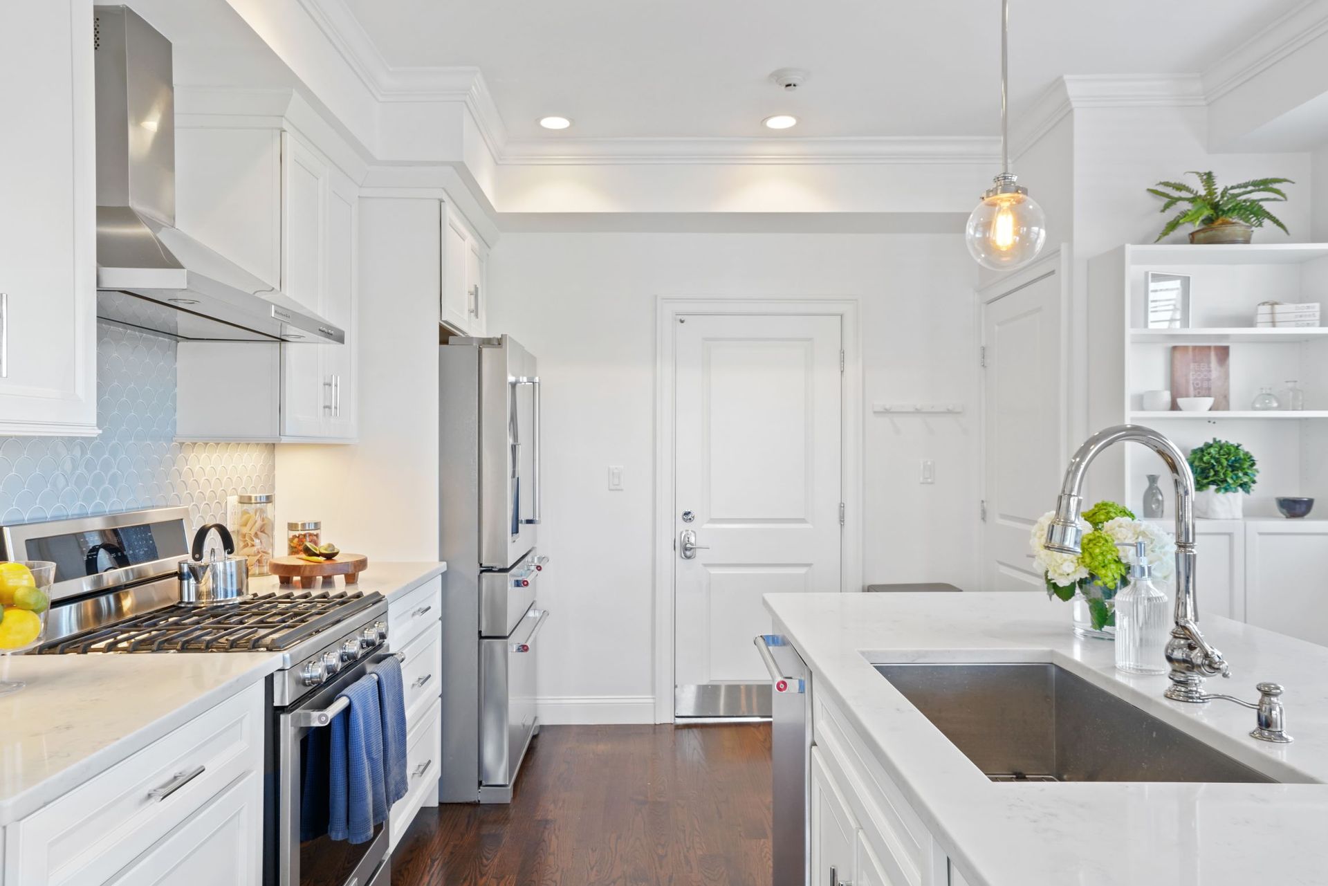 interior photo of kitchen appliances and island sink