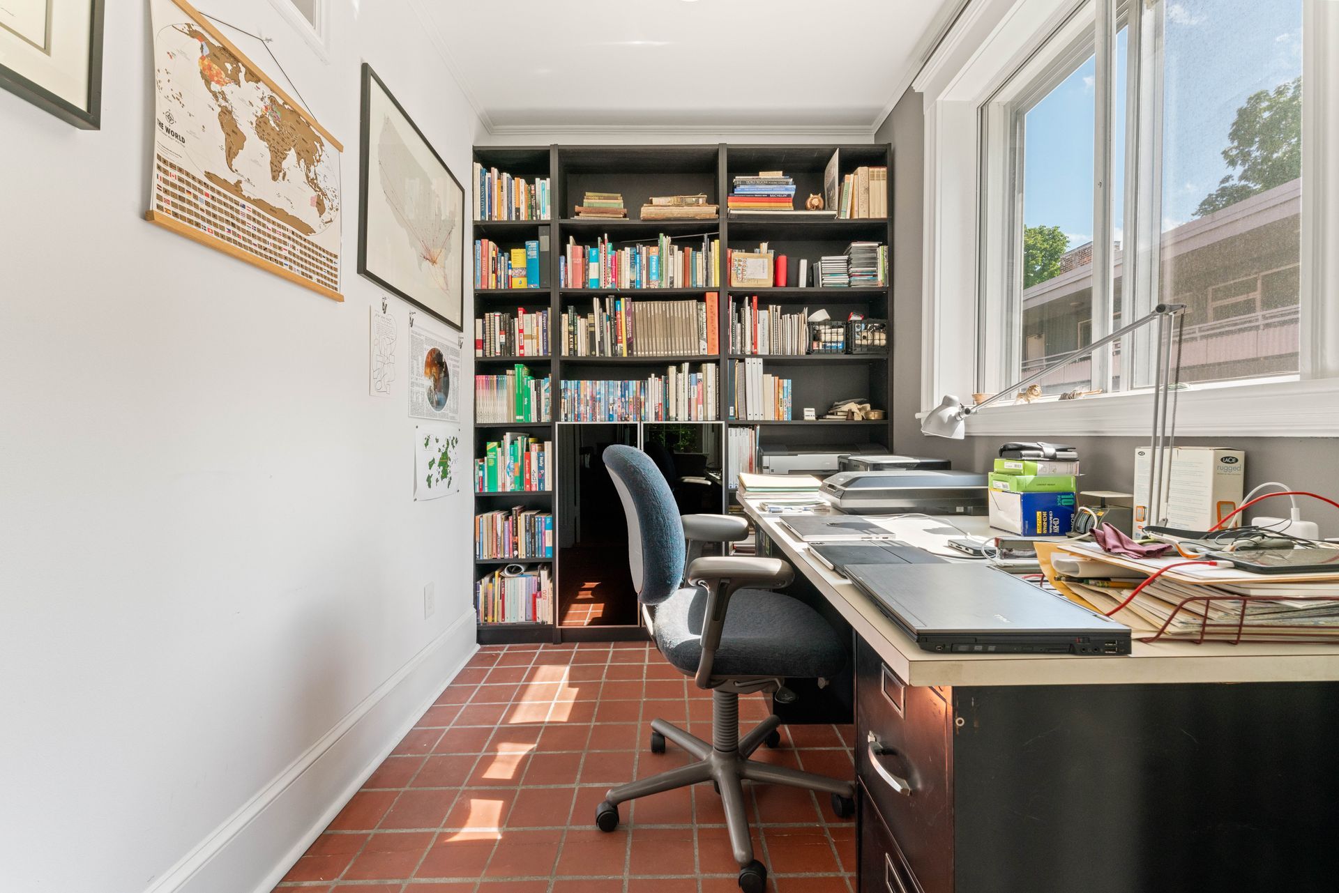 2nd bedroom or office/den with bookcase and window view