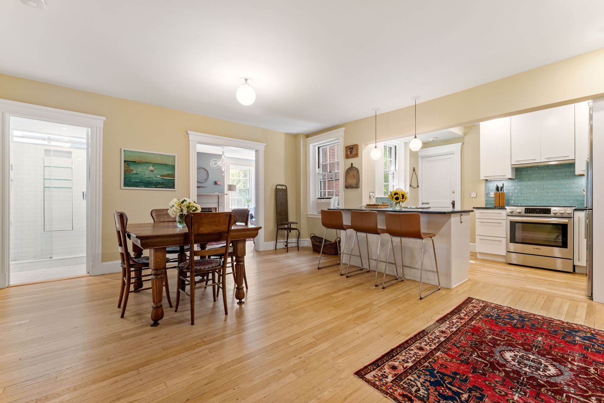 Dining area, kitchen and view through to living room