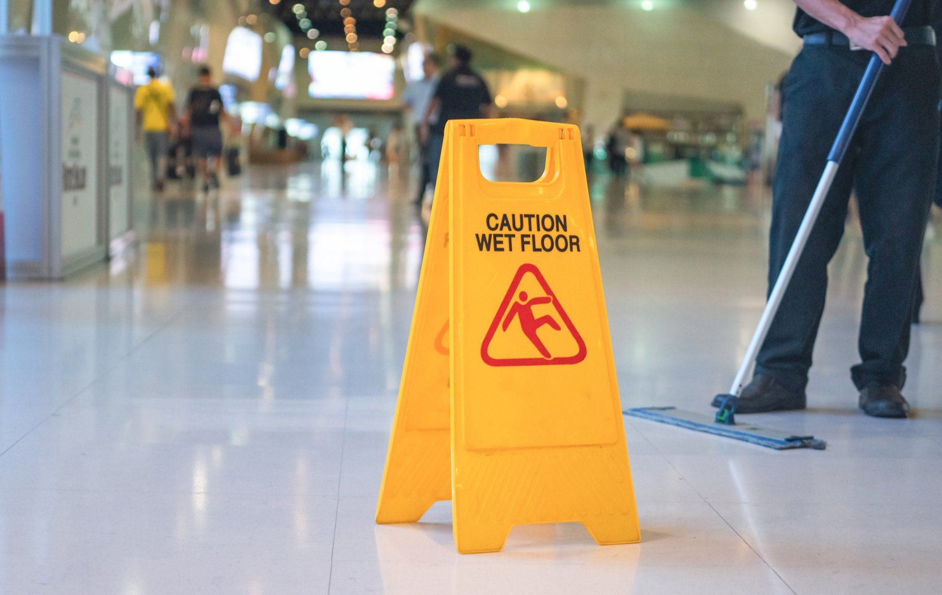 Wet Floor Caution Sign on Floor – Fargo, ND - Automated Maintenance Services, Inc.