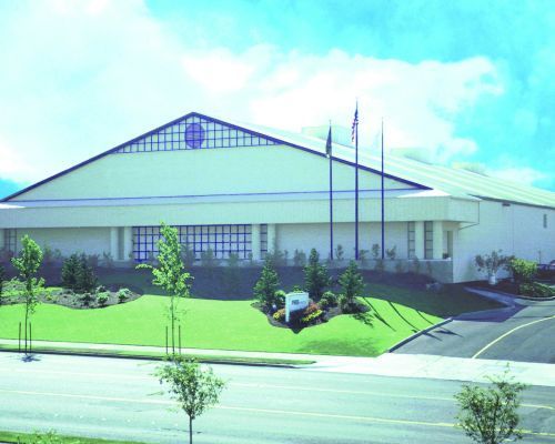  A Large White Building with A Blue Roof Is Sitting Next to A Road - Redmond, WA - Commercial Industries