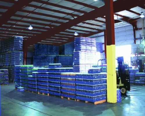 A Warehouse Filled with Lots of Blue Crates and Bottles - Redmond, WA - Commercial Industries