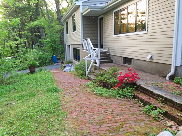 A before picture of a hardscaping job for Leonards Landscaping Corp