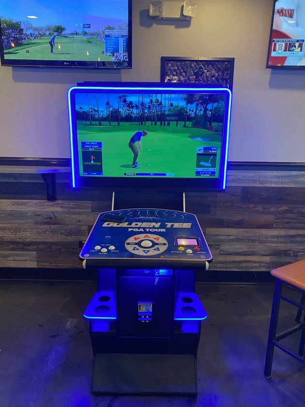 A video game called golden tee is being played