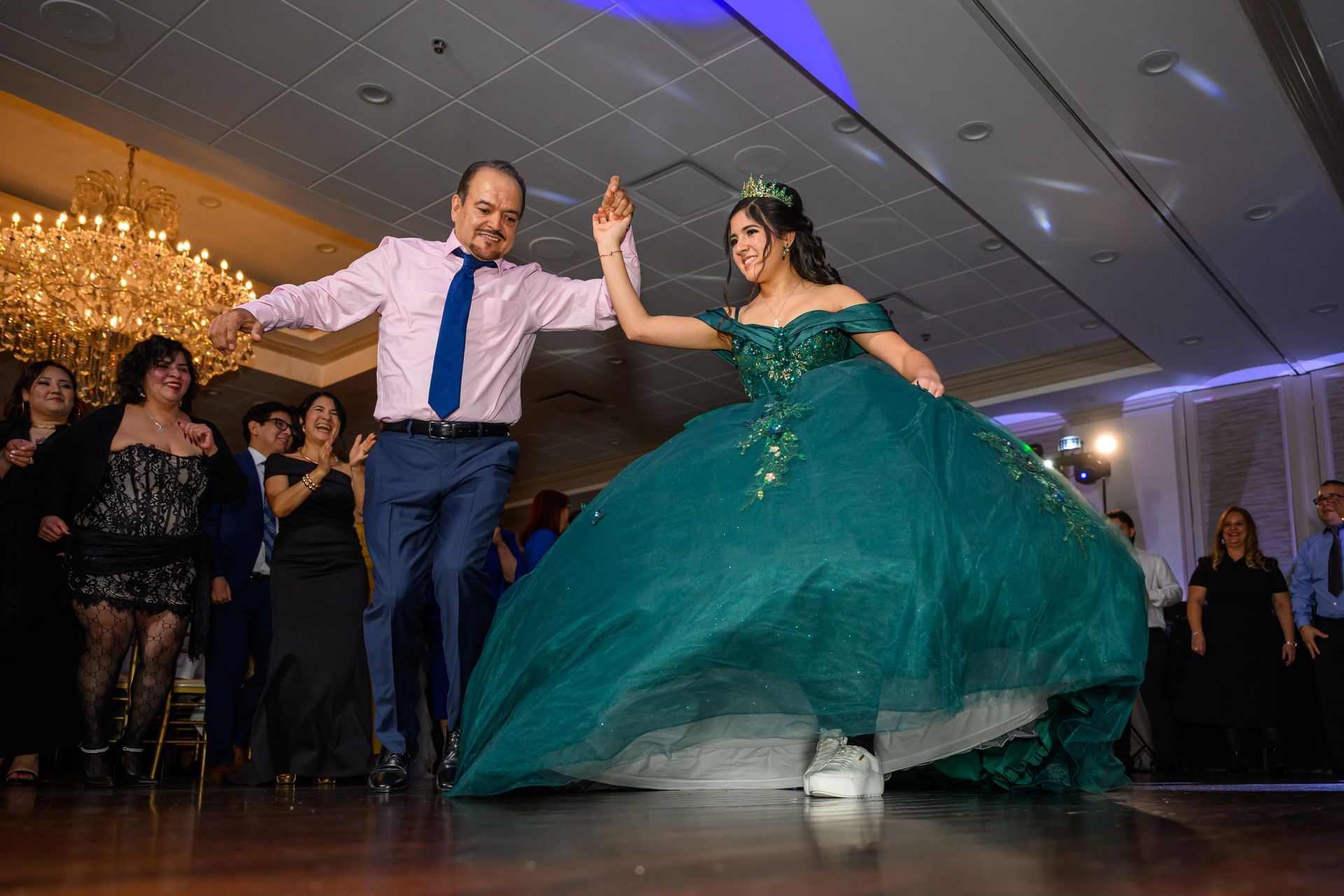 Group of six smiling people posing with a 