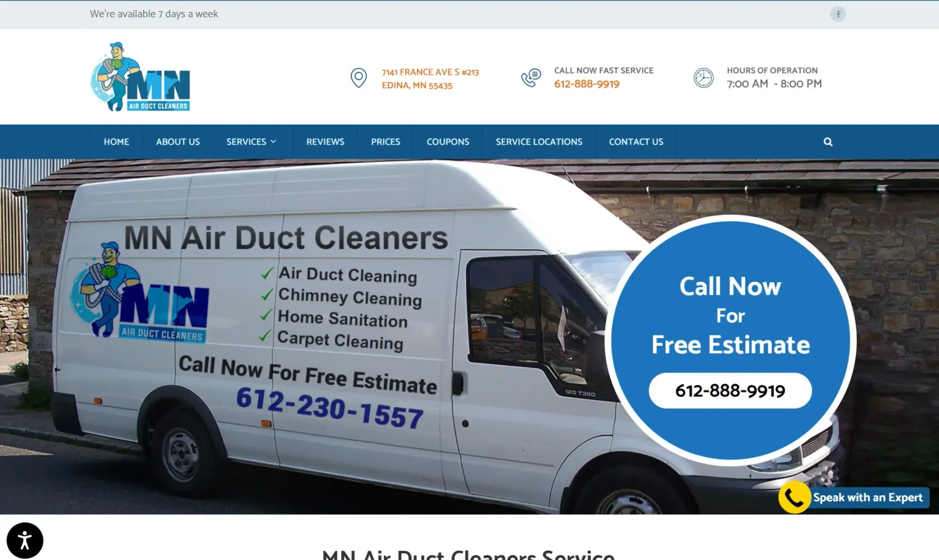 A white van is parked in front of a building.