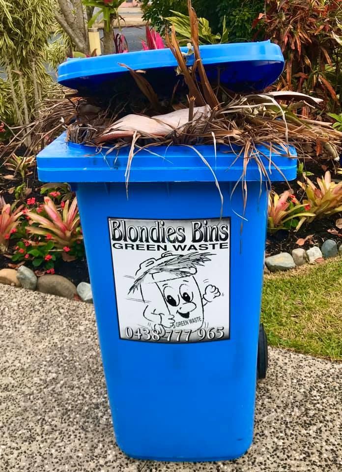 A Blue Trash Can With A Sticker On It That Says Blondes Bins Green Waste — Blondies Bins in Rural View, QLD