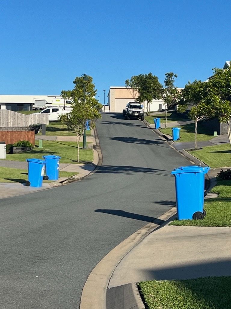 A Potted Plant With Pink And White Flowers In It — Blondies Bins in East Mackay, QLD
