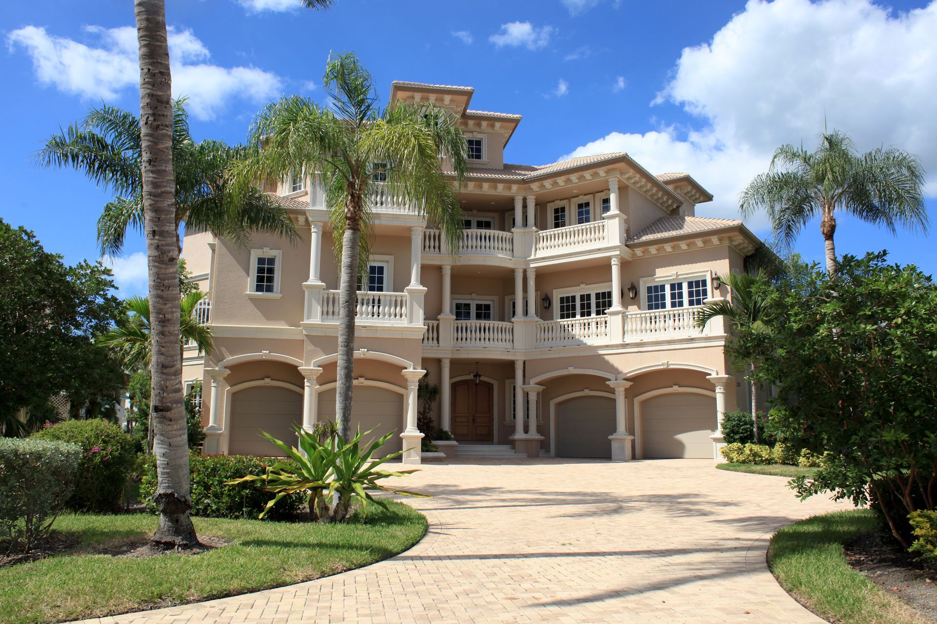 A large house with palm trees in front of it