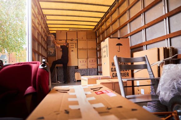 A local moving company helping a family relocate from their old home.