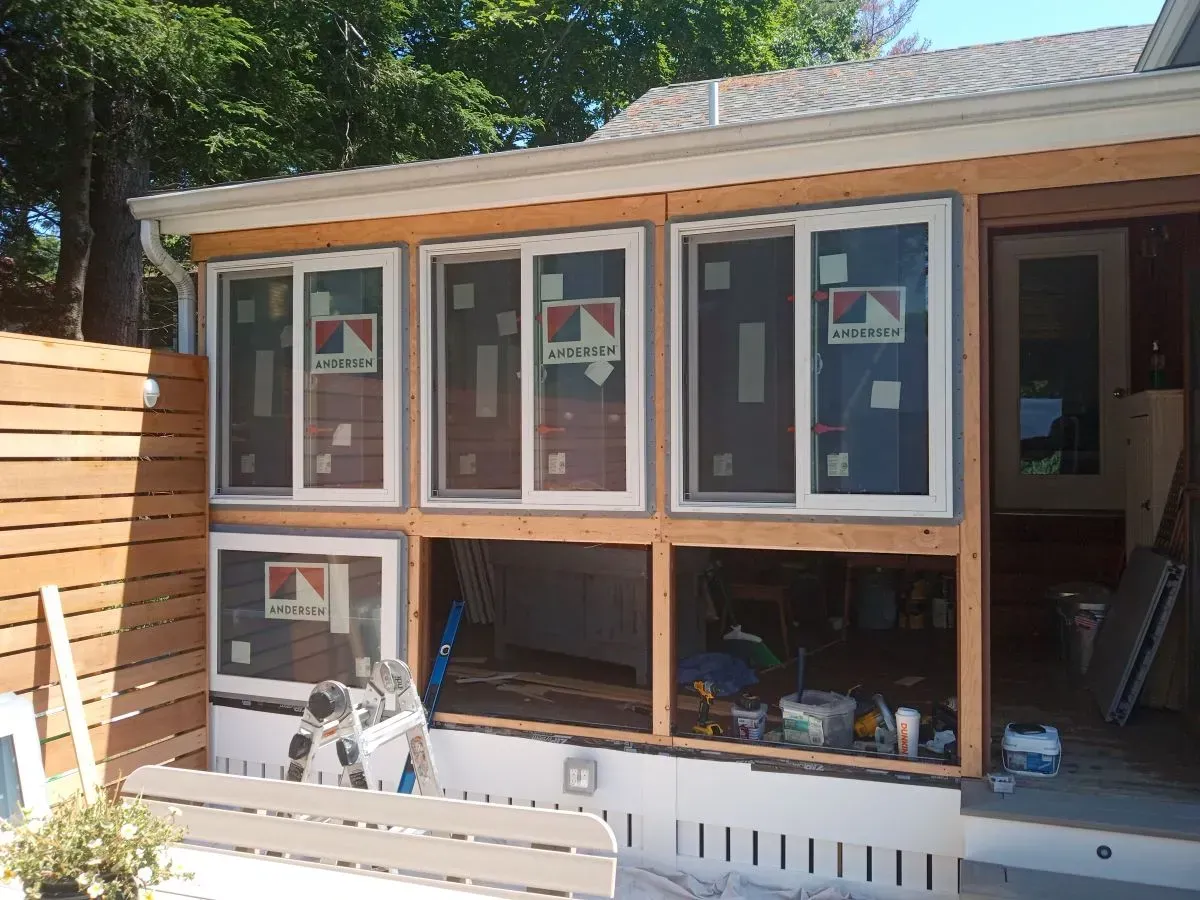 A house with a lot of windows being installed