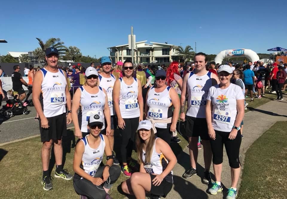 A Group of People Are Posing for a Picture at a Race — Forsyths Accounting Services Pty Ltd in Mackay, QLD