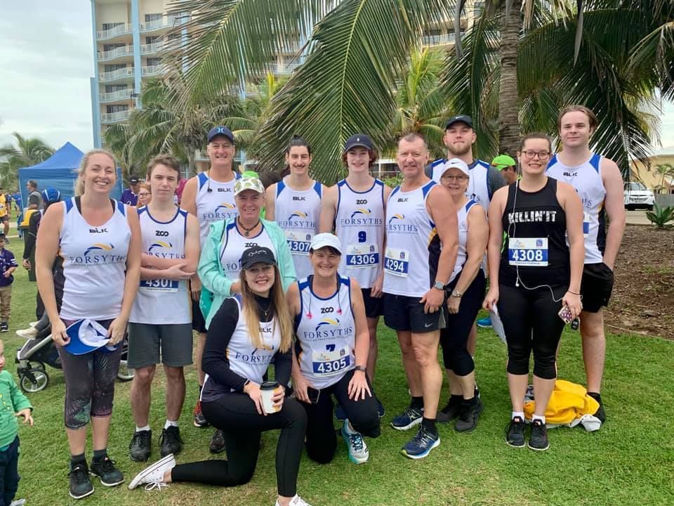 A Group of People Are Posing for a Picture in a Park — Forsyths Accounting Services Pty Ltd in Mackay, QLD