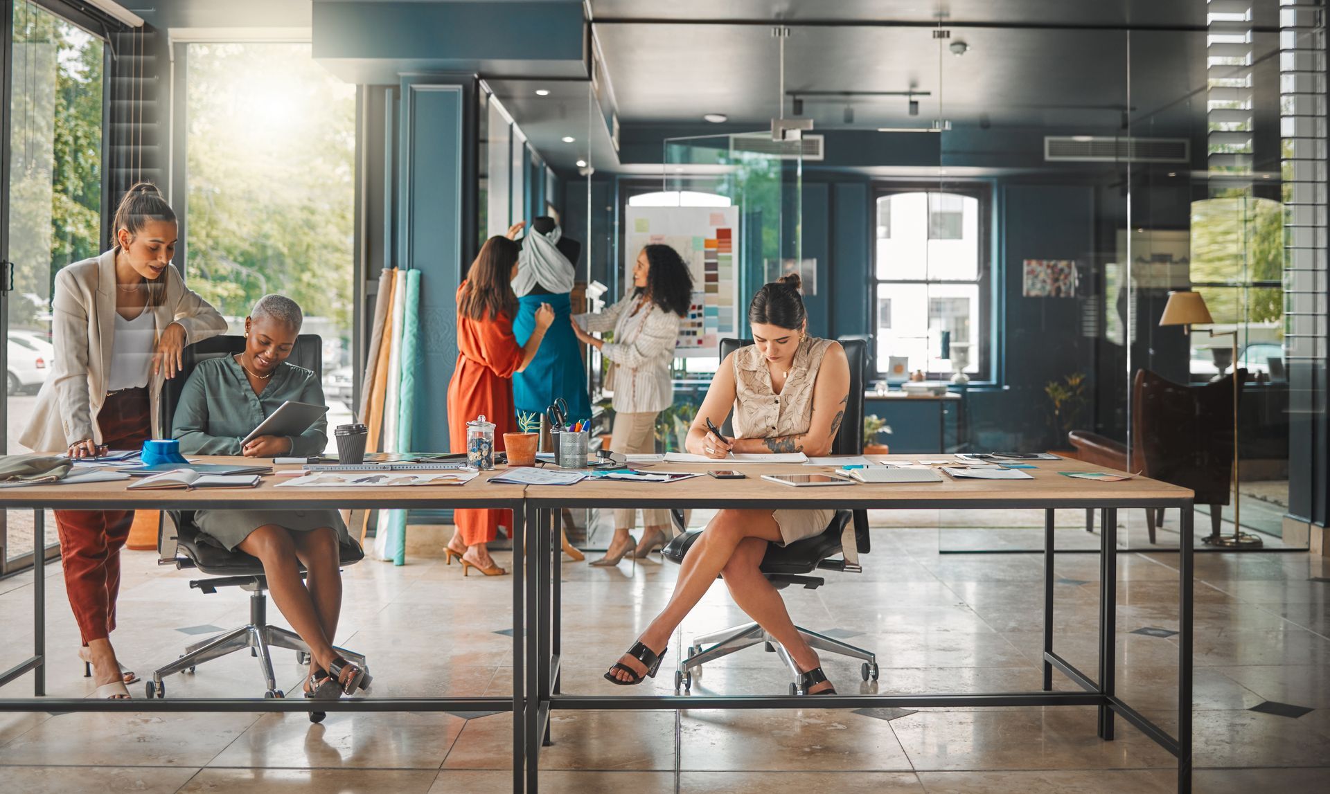 female entrepreneur working on business strategy at desk in open workspace