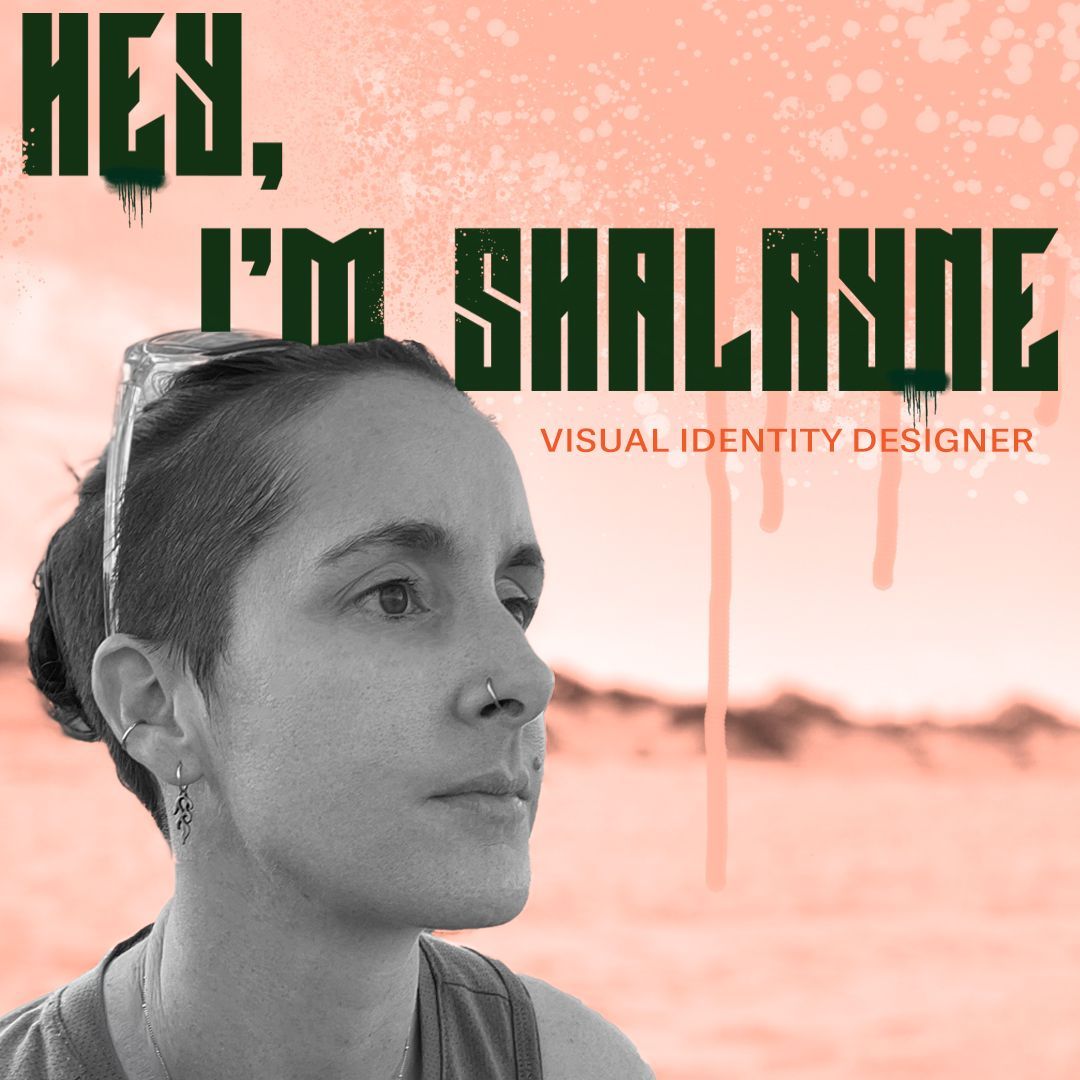 Black and white image of Graphic Designer Shalayne sitting on a beach looking out to the ocean 