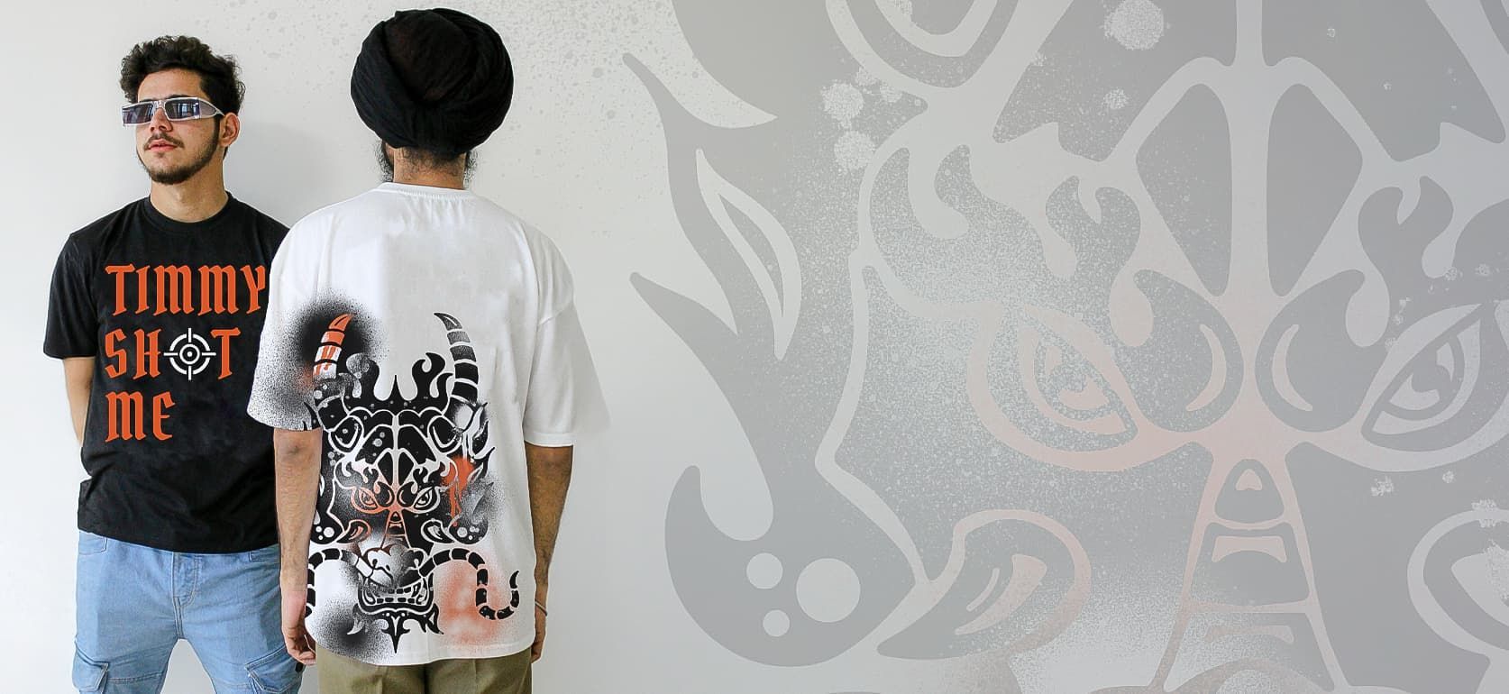 Two men stand wearing t-shirts with custom branded illustrations mocked on them.