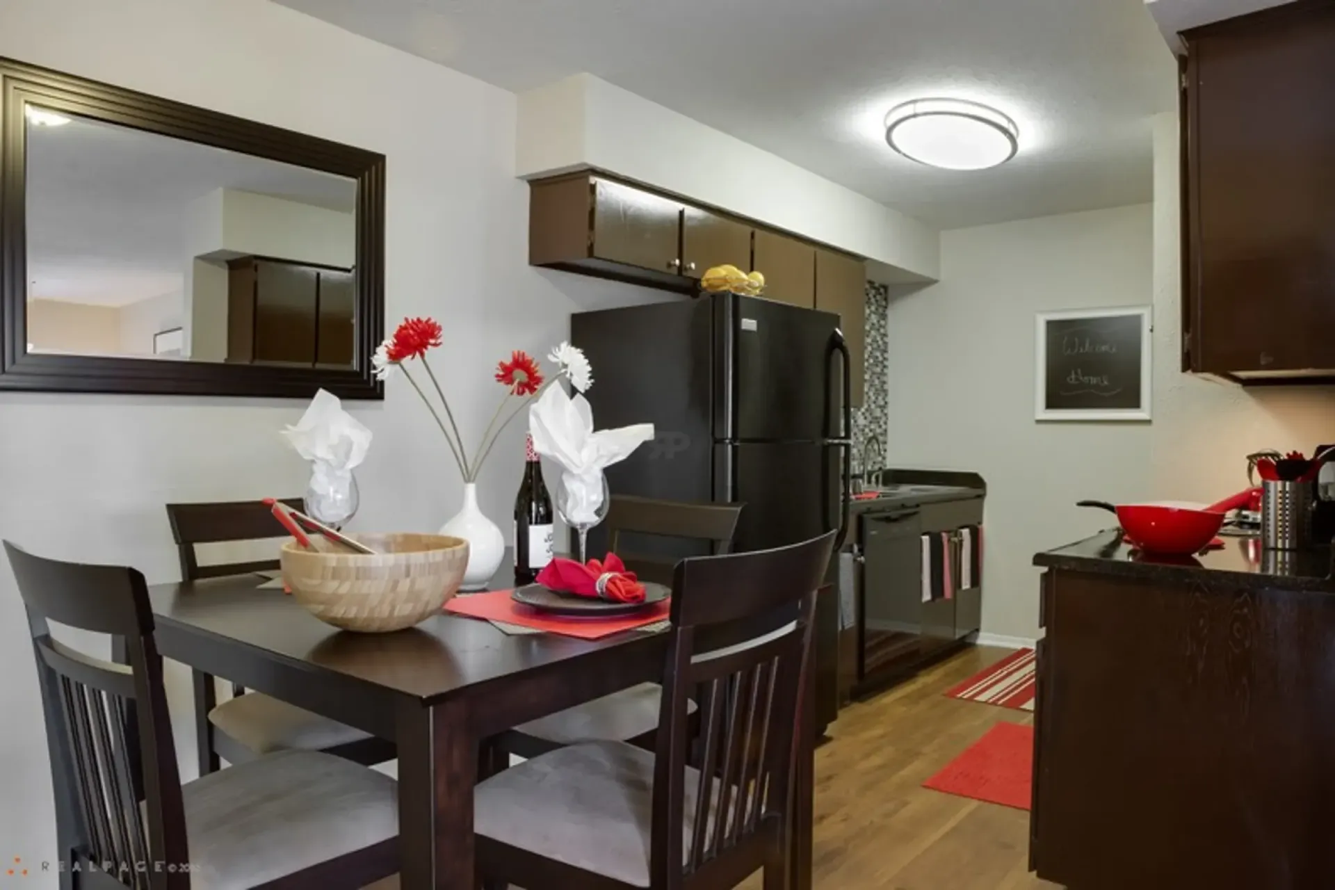 photo of a kitchen and bar stool area