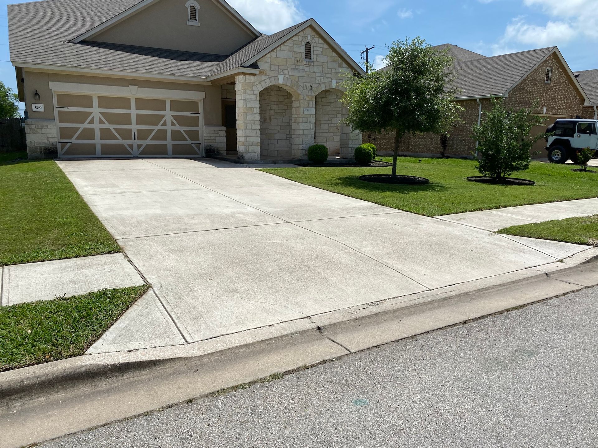 a house with a jeep parked in front of it