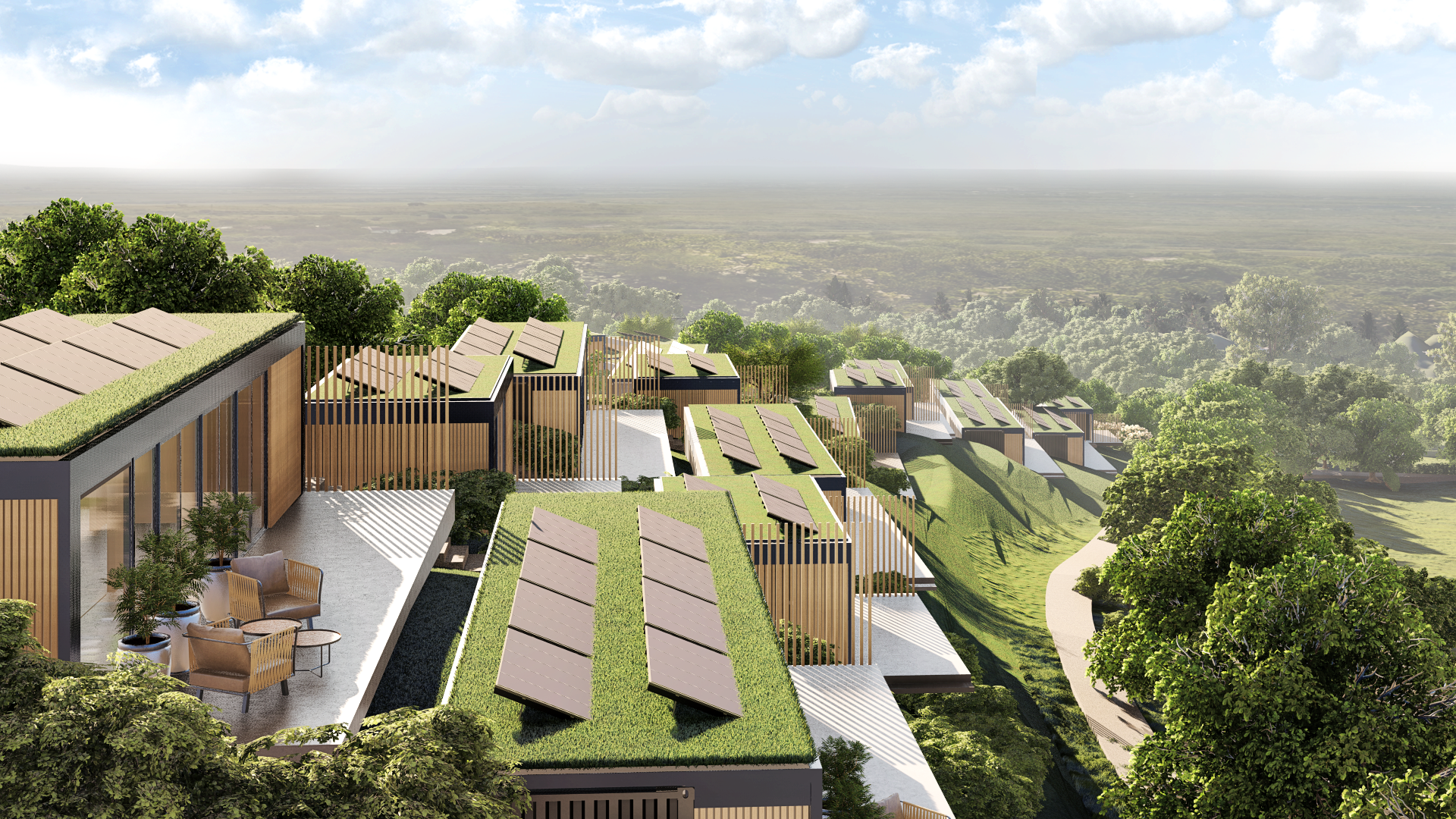 Modern sustainable resort with green roofs and solar panels on a hillside with lush green foliage.