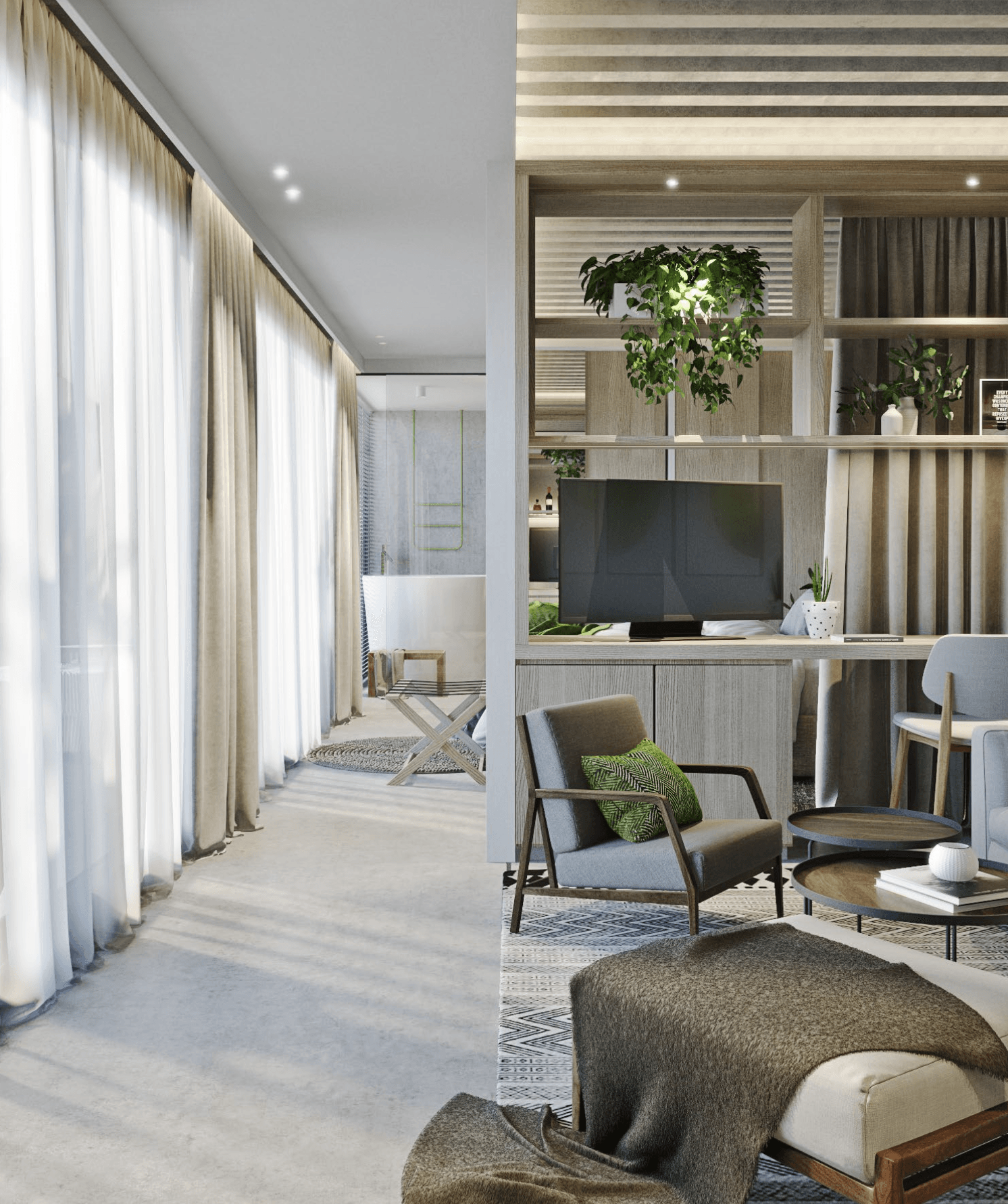 Modern living space, bright with natural light, features a seating area with a TV and a bathroom in the background.