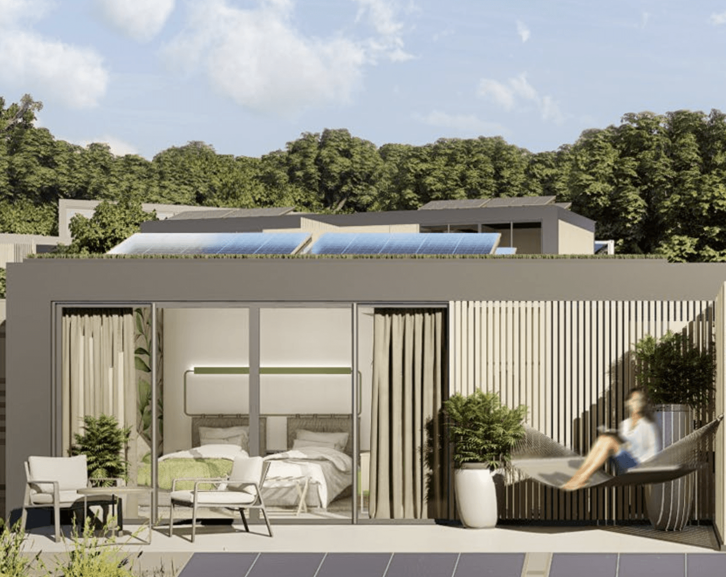 Modern cabin with sliding glass doors, patio, hammock, and bedroom visible. Green trees in background.