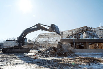 Demolition — Excavators Piling Rocks in Elk River, MN