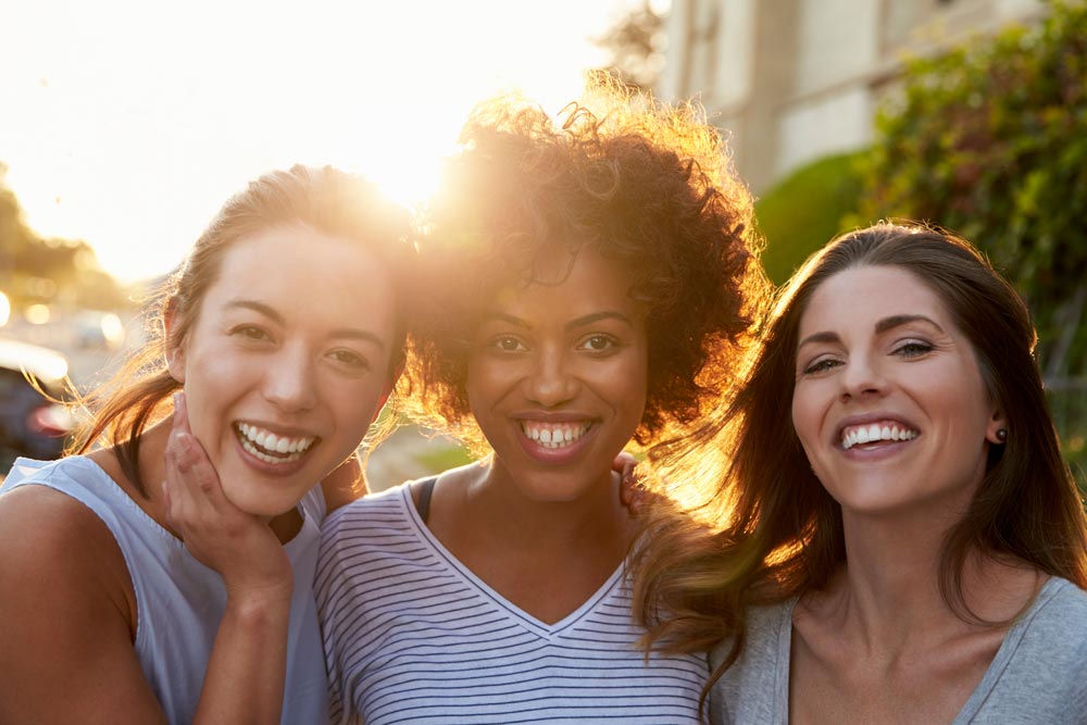 3 smiling ladies