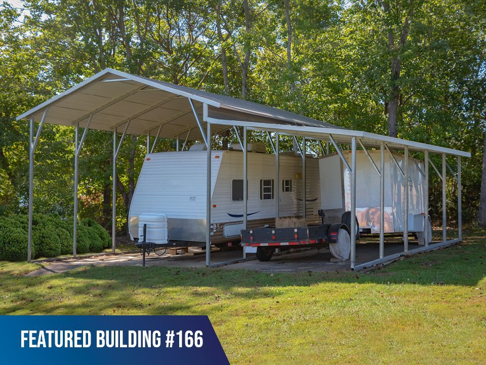 A trailer is parked under a canopy in a featured building # 166