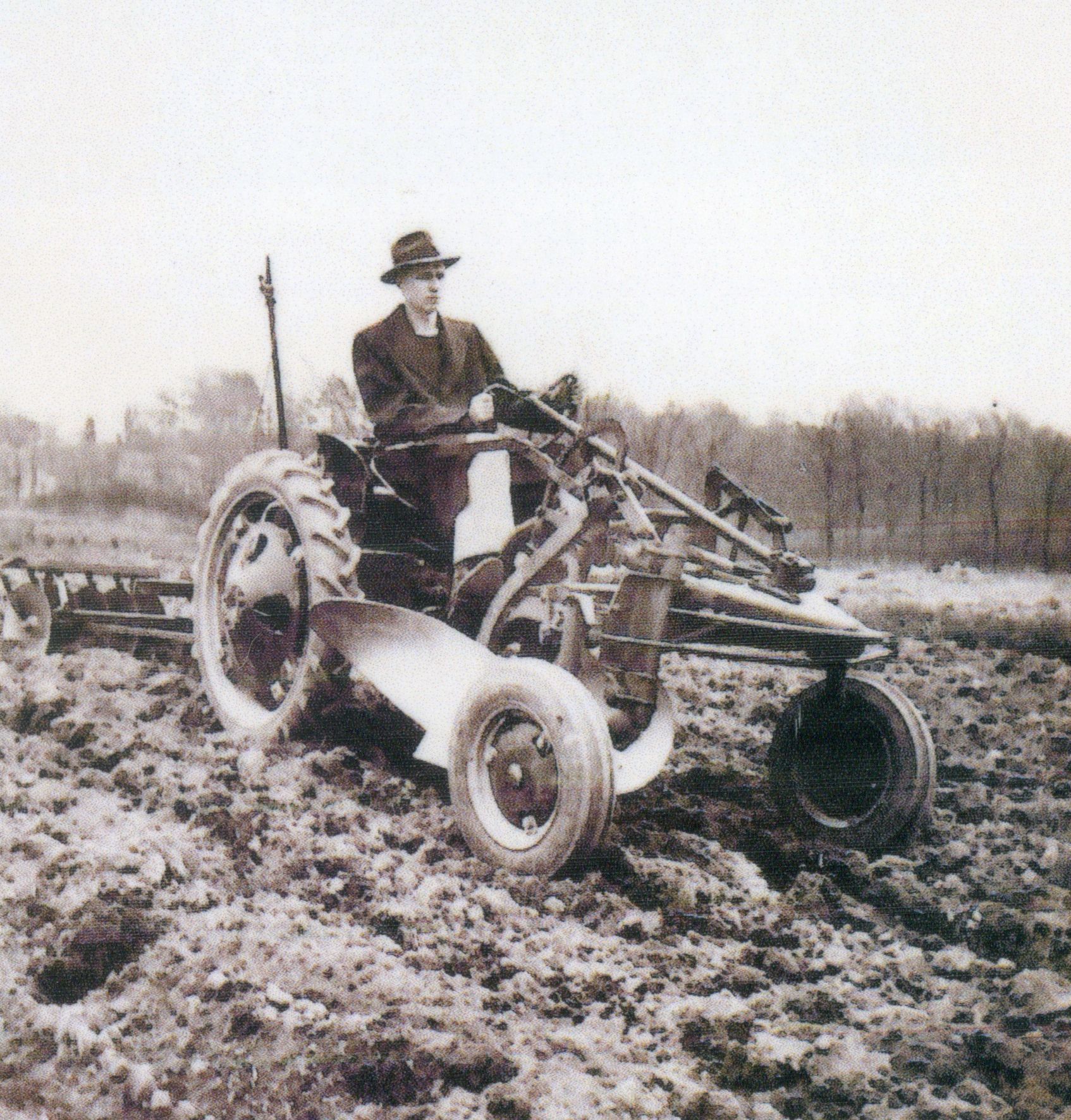 historical photo of tractor operator