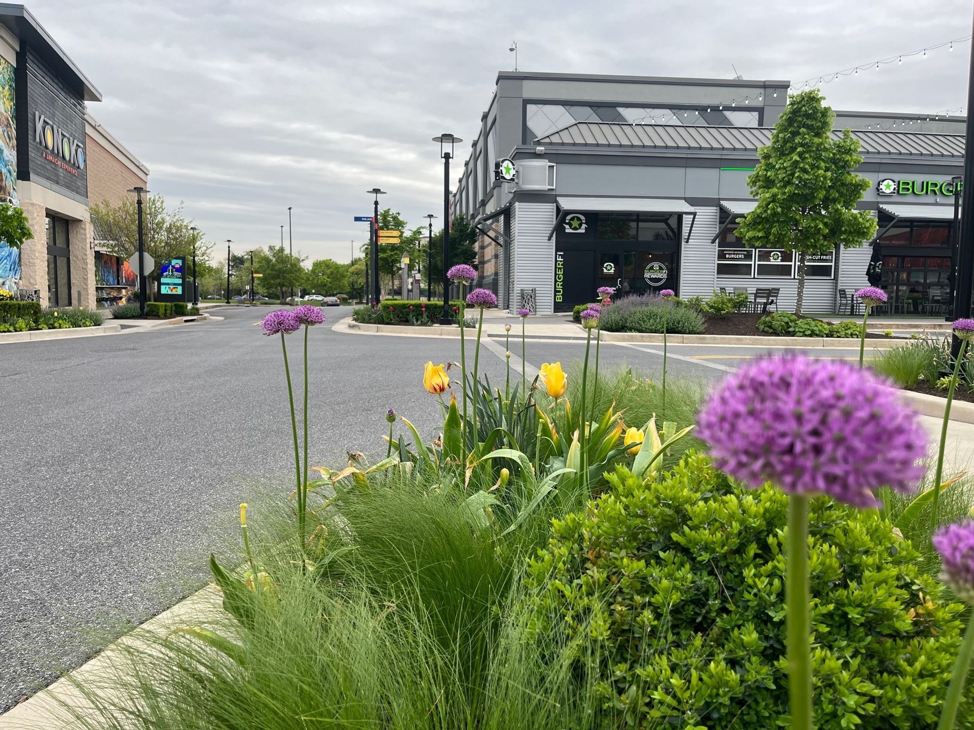 A brick building with a red door and stairs.