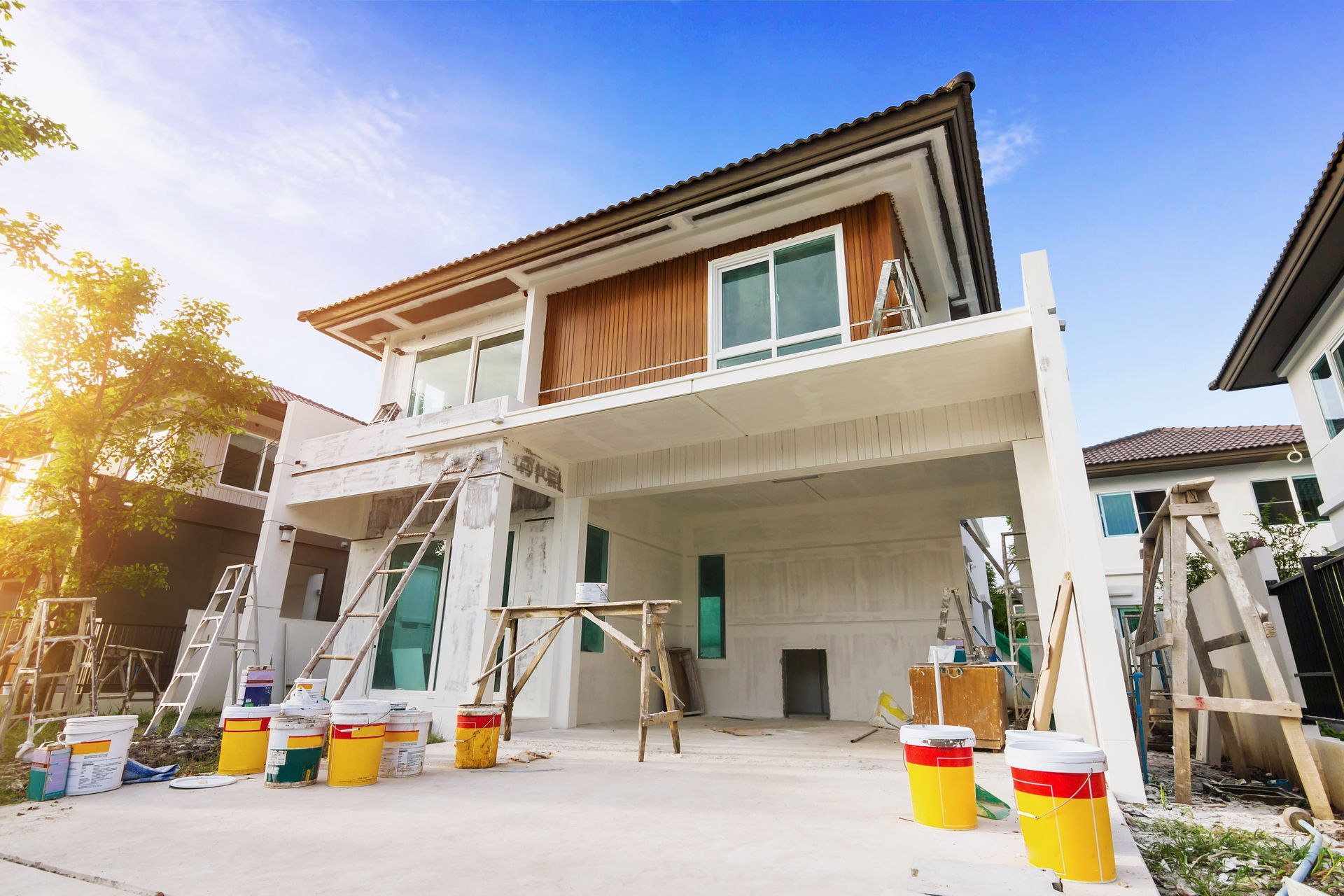 Exterior view of new house under construction and painting