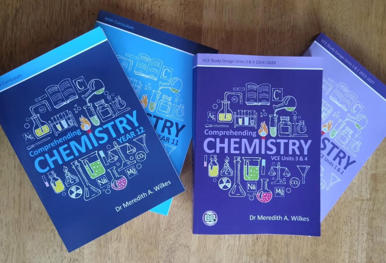 Three Chemistry Books Are Sitting on a Wooden Table — The Molecule Mentor in Lorn, NSW
