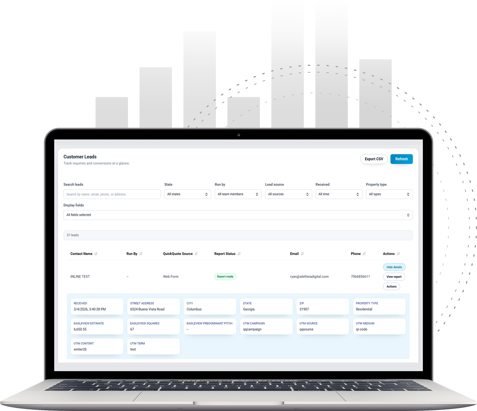 A laptop displaying a data analytics dashboard with charts in the background, set against a clean, professional backdrop.