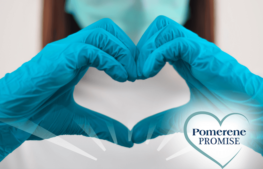 Hands in blue gloves form a heart shape, with a 