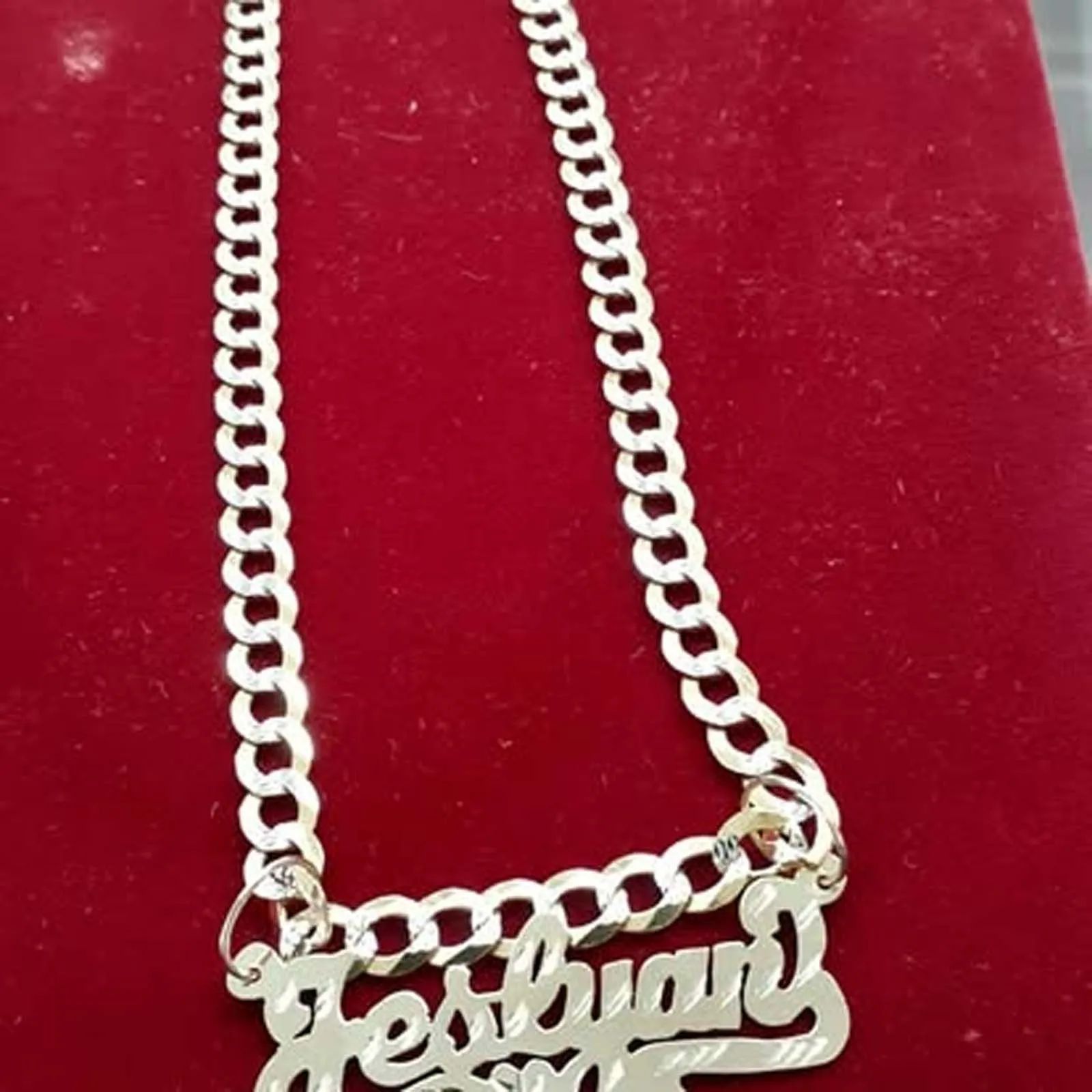 A necklace with the word festival on it