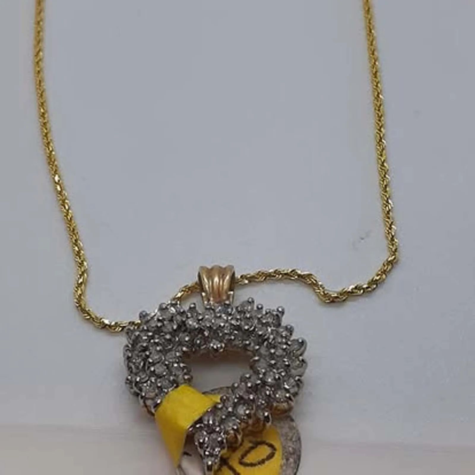 A necklace with a yellow tag that says 10 on it