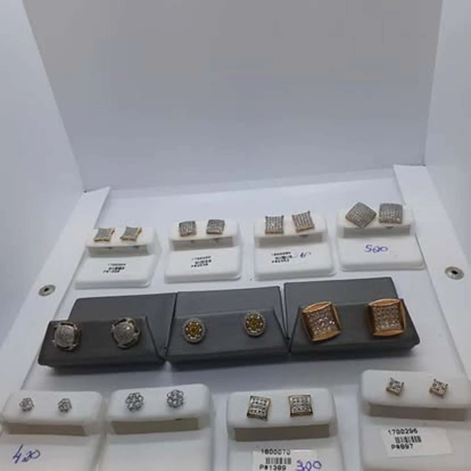 A variety of earrings and cufflinks are on display