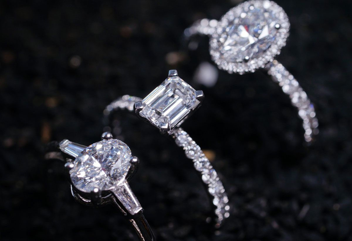 Three rings are sitting on top of each other on a black surface.