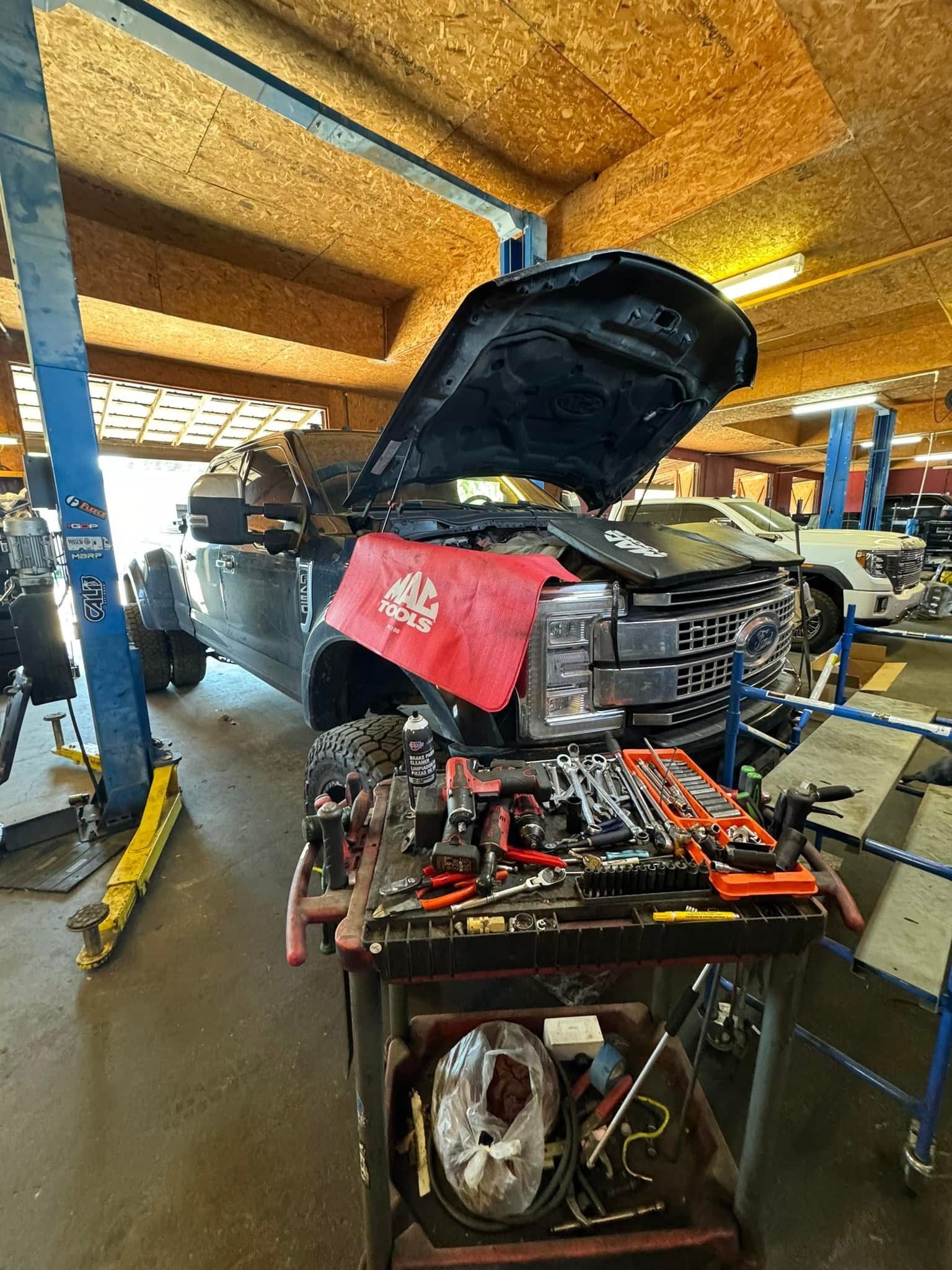 Ford Super Duty Truck with its Hood Open | Brian’s Diesel Performance