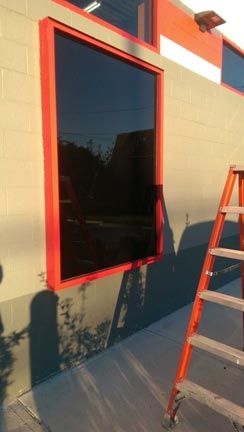 Glass Window with red frame — Commercial Door and Locks in Albany County, NY